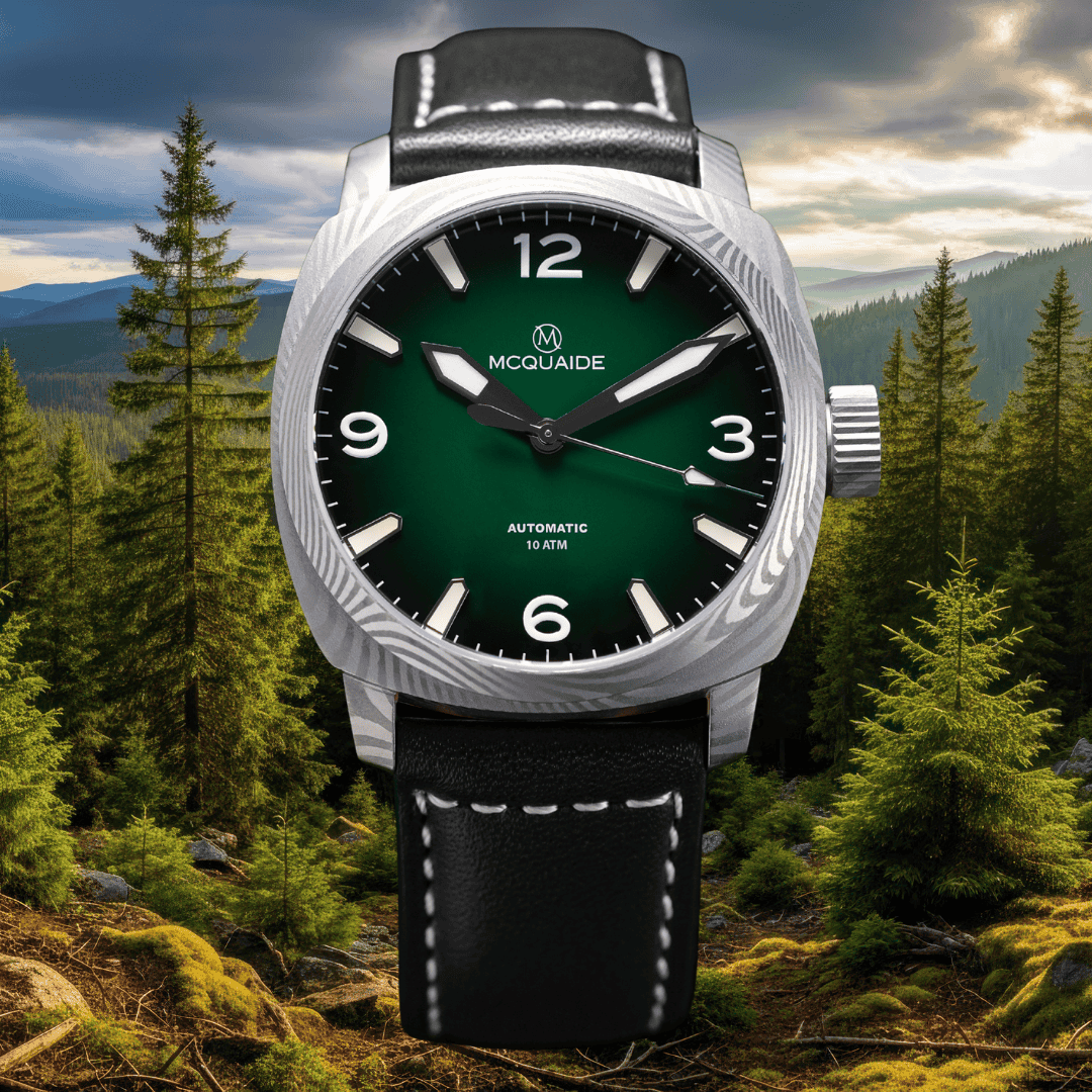 The McQuaide C1 evergeen with a forrest background with a black strap