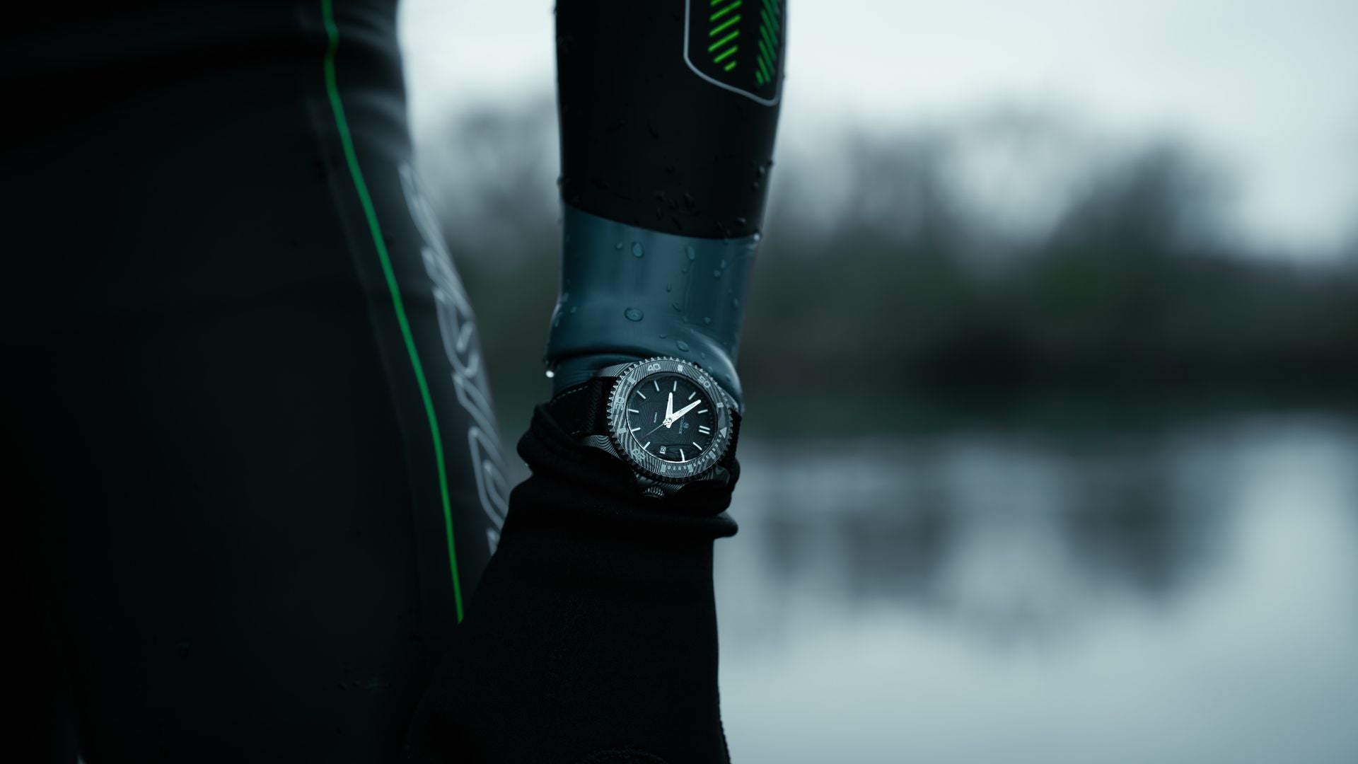 McQuaide Q1 Damascus Steel watch on a wetsuit