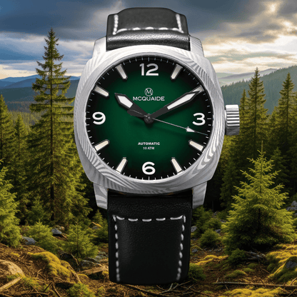 The McQuaide C1 evergeen with a forrest background with a black strap