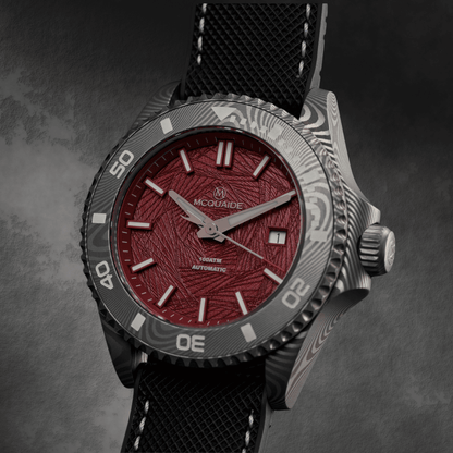 Front angleof the McQuaide Q1 Crimson Damascus Steel watch