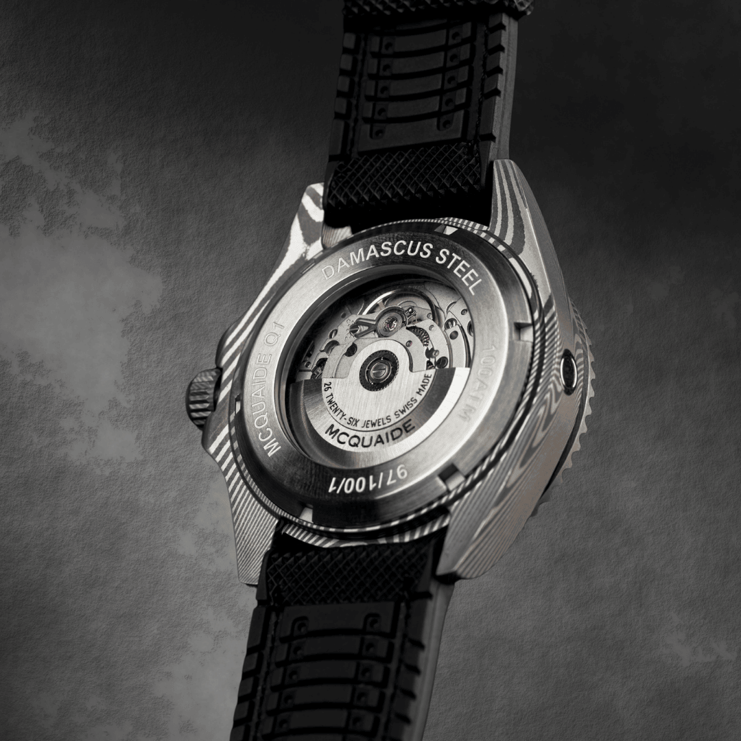 Portrait caseback of the McQuaide Q1 Damascus Steel watch