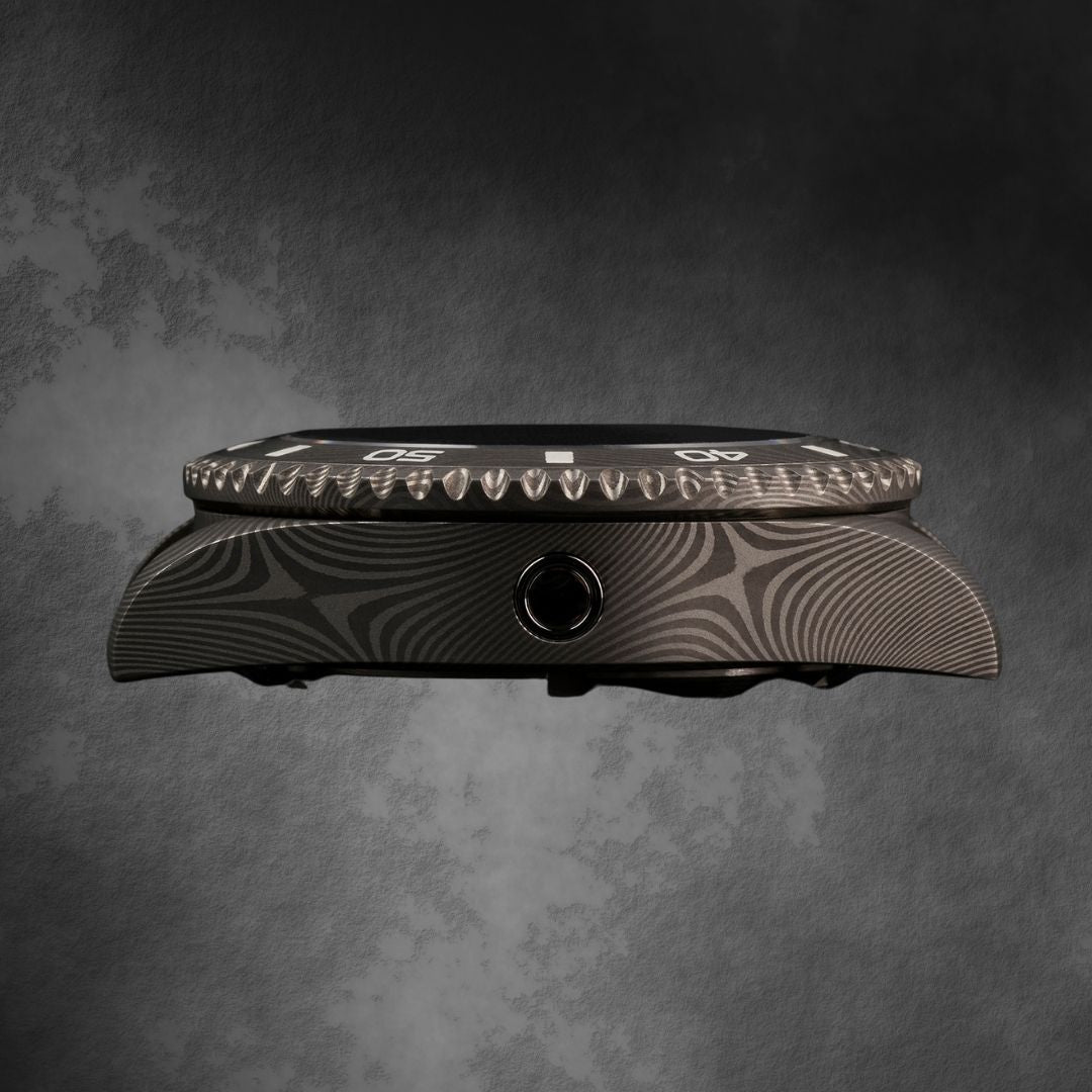 Side profile 2 of the McQuaide Q1 Damascus Steel watch with the helium escape valve