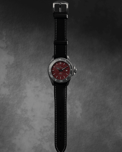 Straight photo of the McQuaie Q1 Crimson Damascus Steel watch