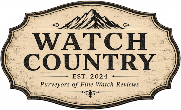 A vintage-style cream and black label graphic with a mountain illustration above the words 'WATCH COUNTRY' and smaller text 'EST. 2024' and 'Purveyors of Fine Watch Reviews'.